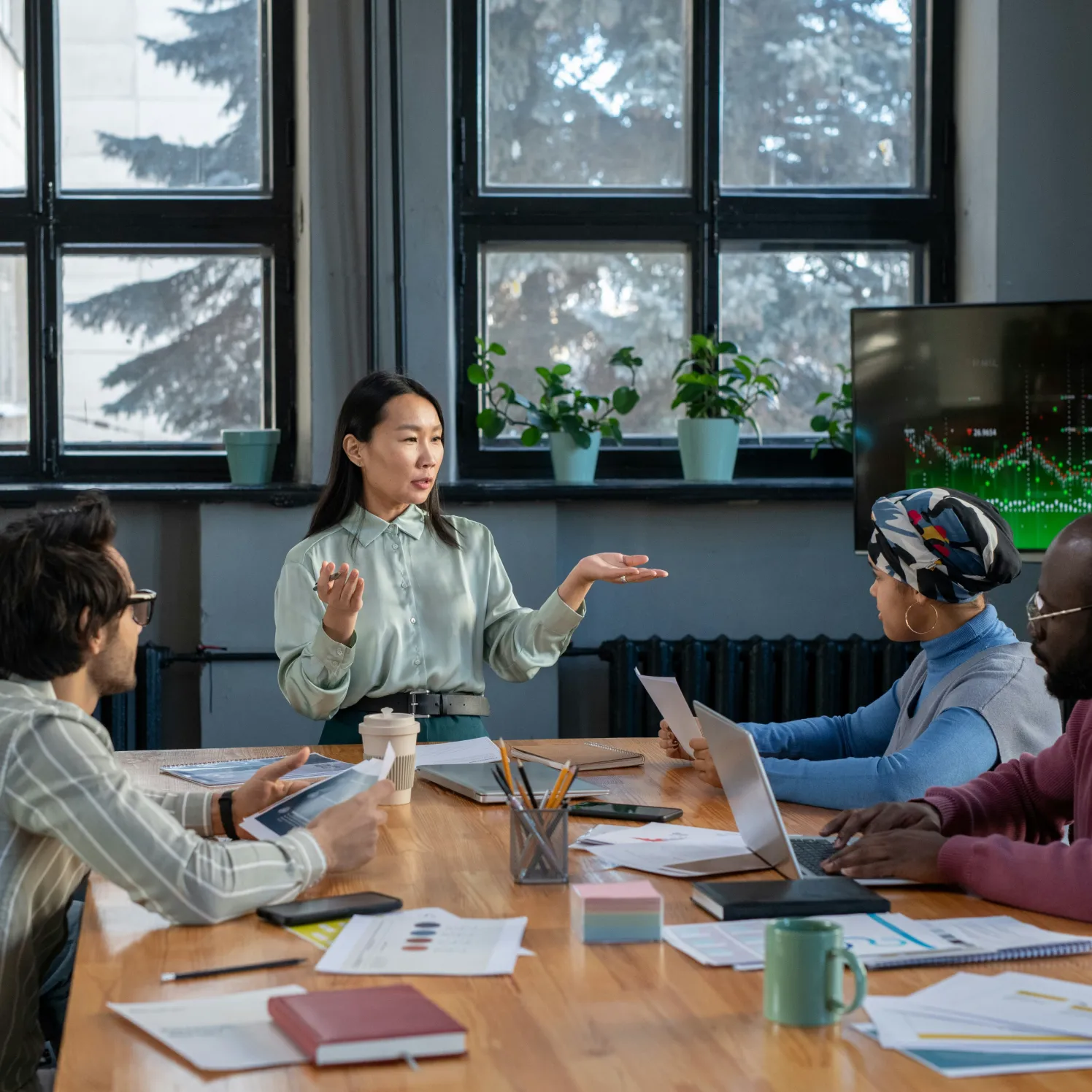 A diverse team in discussion around a meeting table