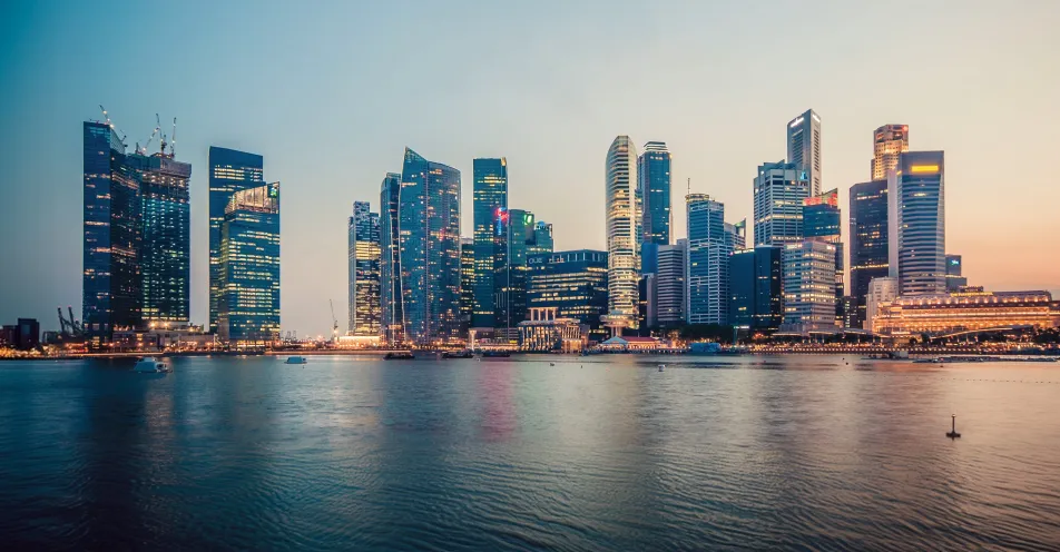 Singapore skyline across the bay at dusk