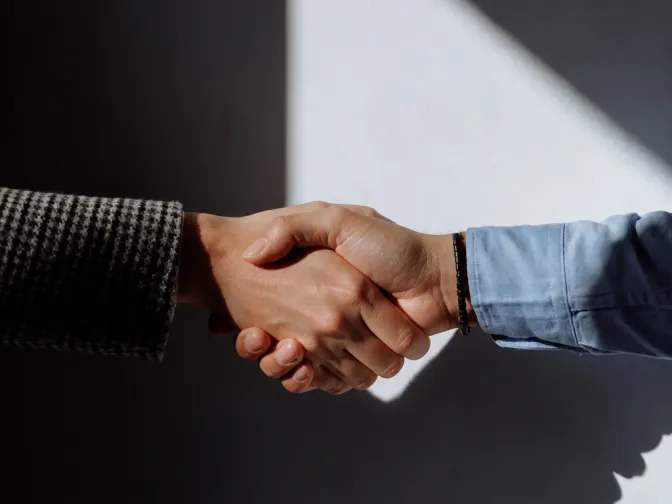 Two people shaking hands