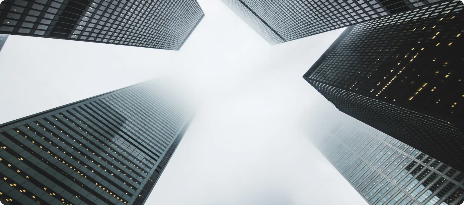 Office towers seen looking straight up between them