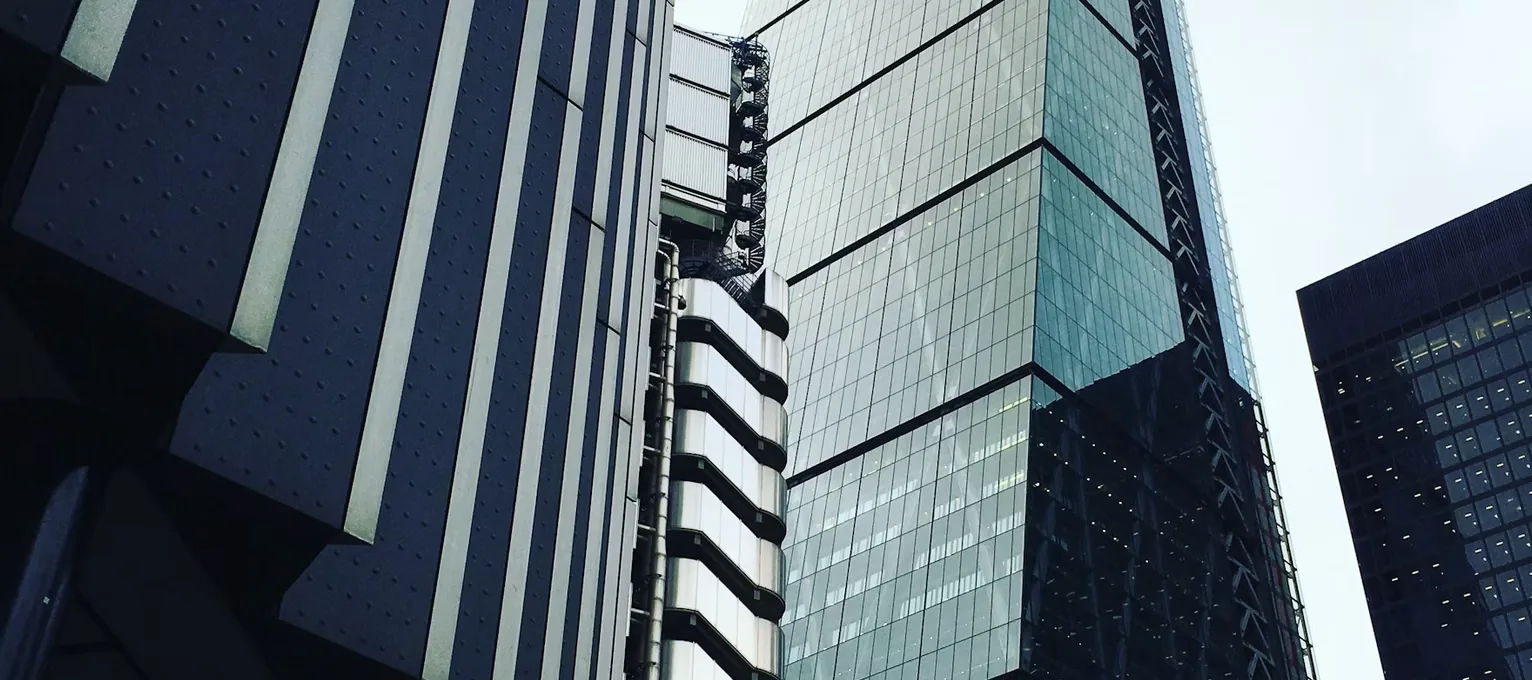 Glass and steel office towers seen looking up from the street